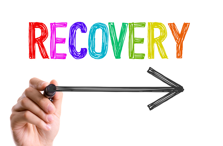 Image of a hand holding an arrow below word "RECOVERY".