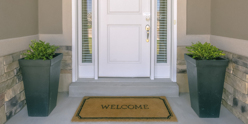 Front door with welcome mat