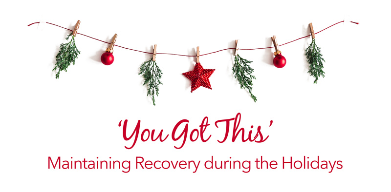 'you got this': Maintaining Recovery during the Holidays, holly and bells hanging from string