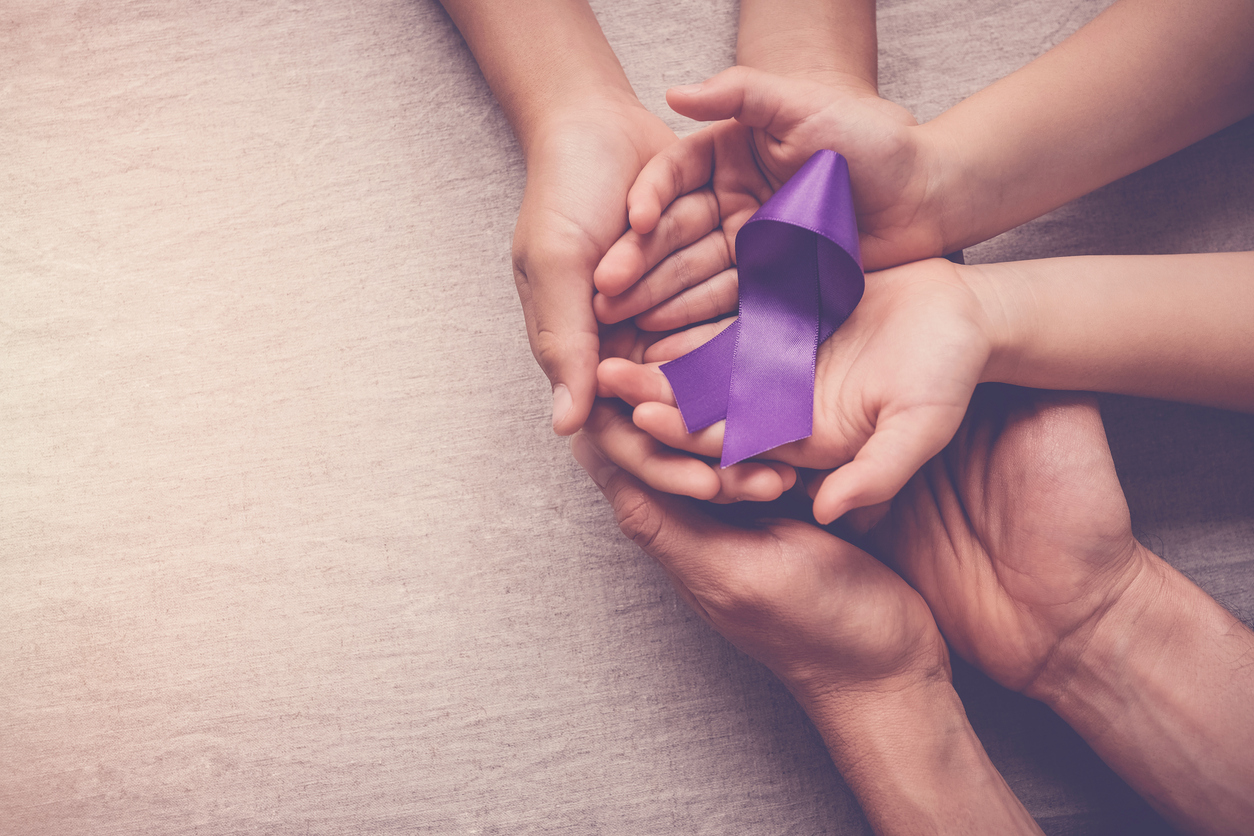 Purple ribbon with hands